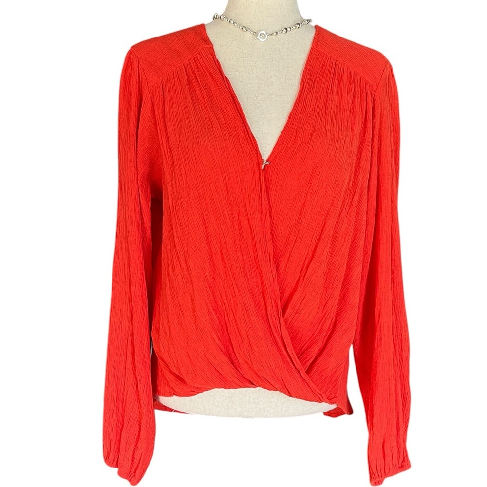 Free People "Check On It" crinkle gauze wrap top in a bright orange-red flame